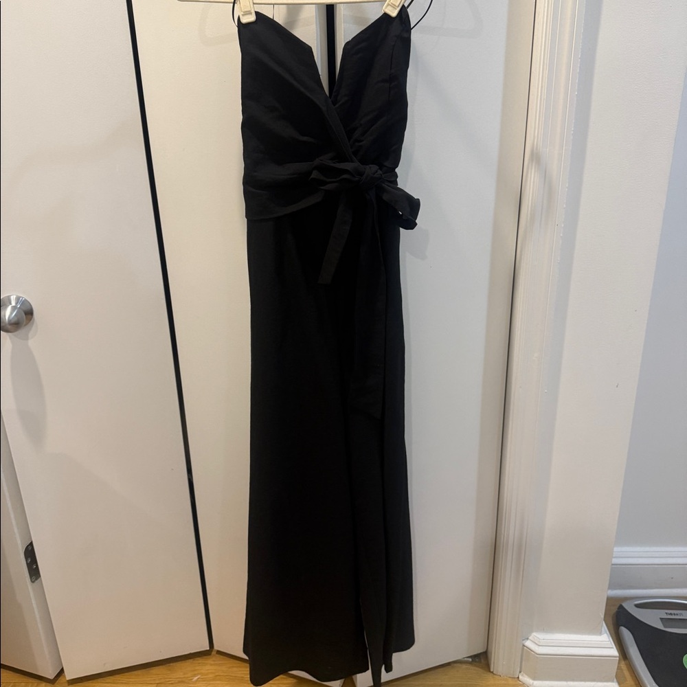 Black romper with tie at waist and v cut. It ends at my ankles and I’m 5’2